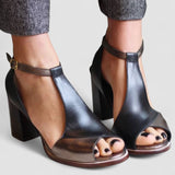 Black high-heeled sandals with open toes in patchwork style