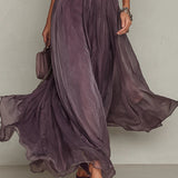 Flávia's long purple dress with a plunging neckline
