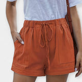 Pants with an adjustable belt
