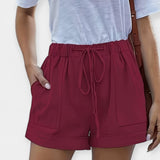 Pants with an adjustable belt