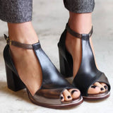 Black high-heeled sandals with open toes in patchwork style