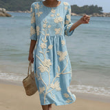 Midi dress with a plant and floral pattern